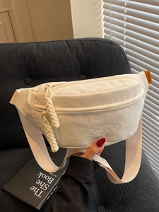 White canvas crescent crossbody bag with embroidery and adjustable strap for women