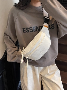 Minimalist white canvas half-moon crossbody chest bag with adjustable wide shoulder strap