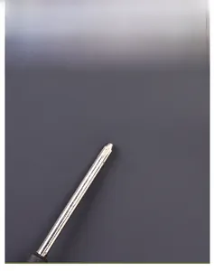 Macro shot showing the scratch-resistant durable washed denim fabric using a screwdriver