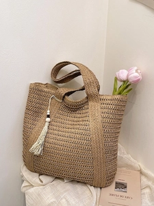 Lazy style straw woven tote bag for women with bohemian tassel and summer vacation vibes