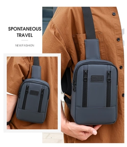 Outdoor street view showing the side and front angles of the dark grey sports chest bag