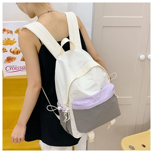 Lightweight waterproof outdoor travel backpack with purple and grey color-blocked pockets