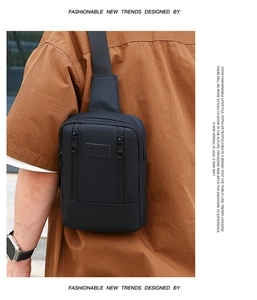 Detail of black sports chest bag featuring sport logo and adjustable nylon strap