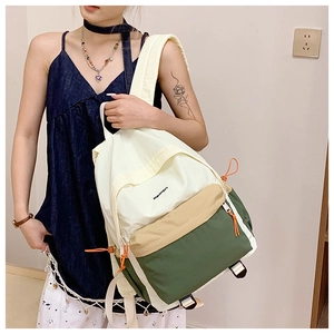 Detail of tricolor outdoor backpack with miguangyu print and orange drawstring zippers