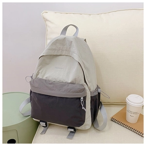 Close-up of lightweight nylon travel backpack with water-resistant fabric and side pocket