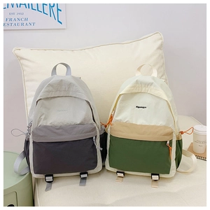Detail of color-block hiking backpacks showing durable fabric and brand embroidery