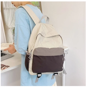 Detail of outdoor travel backpack side pocket with drawstring and adjustable bottom straps