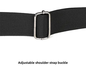 Detail of adjustable shoulder strap with silver metal buckle on washed denim bag