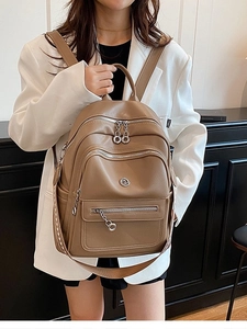 Women's khaki lychee grain leather backpack with silver zippers and large capacity