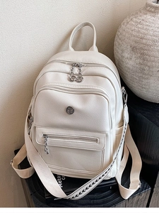 Chic beige faux leather backpack with litchi texture and patterned straps for women