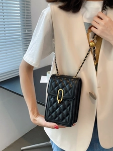 Quilted black crossbody phone bag with gold chain strap and metal clasp detail