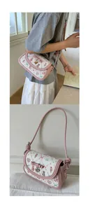 Close-up of heart charm and pink bow on printed floral crossbody bag for women