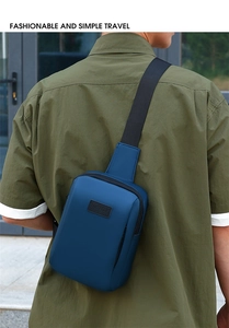 Macro detail of the navy blue waterproof nylon chest bag with black SPORT leather patch