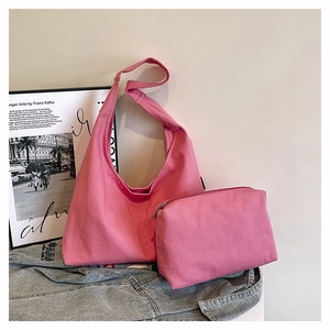 Detailed view of pink canvas tote bag set with matching zipper coin pouch