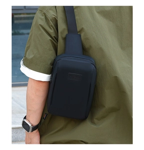 Close-up of black waterproof chest bag featuring a Sport patch and adjustable strap