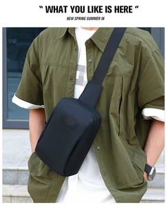 Close-up of black matte waterproof nylon chest bag with rubber SPORT logo on a model