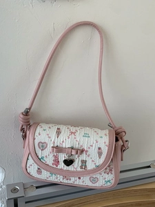 Pink ballet-style crossbody bag with floral animal prints and ribbon bow detail