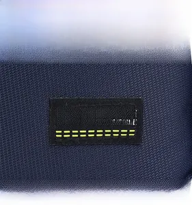 Close-up of navy blue twill fabric detail with FASHION SPORT STYLE embroidered woven label