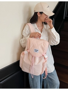 Lightweight pink canvas backpack for women featuring large capacity and a flap cover design