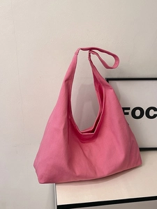 Pink canvas large tote bag with minimalist crescent shape for daily commuting and school