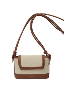 Minimalist beige canvas and brown leather crossbody bag with knot strap detail