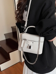 Chic white lychee leather crossbody square bag with silver chain strap on model