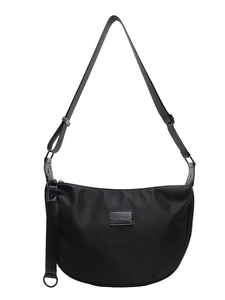 Minimalist black nylon crescent crossbody bag with adjustable strap and brand logo