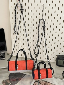 Mini orange cylindrical running crossbody bags in two sizes for outdoor sports storage