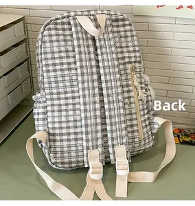 Detail back view of a plaid backpack featuring adjustable straps and anti-theft zipper pocket