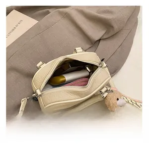 Interior view of cream lychee texture mini bowling bag showing daily item storage