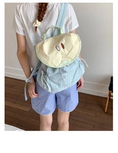 Detail view of cute macaron fruit backpack with waterproof fabric and adjustable drawstrings