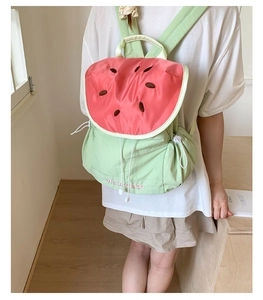Detailed embroidery of seeds and Watermelon text on vibrant contrast backpack