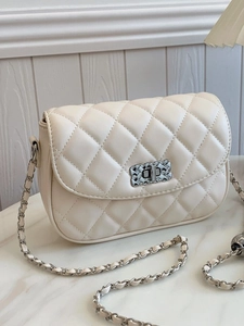 Chic beige quilted crossbody bag with chain strap and elegant metallic twist lock detail