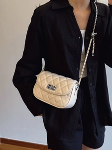 Chic beige quilted square crossbody bag with silver chain strap and metal lock