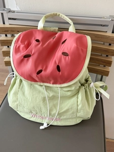 Watermelon shaped colorblock backpack in red and green with embroidery and drawstring