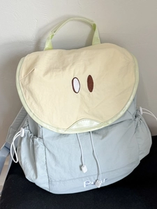 Cute green and yellow pear-themed backpack with cartoon eye embroidery and drawstring pockets
