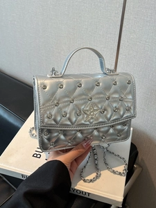 Silver quilted crossbody bag with rhinestone studs and star detail for stylish women