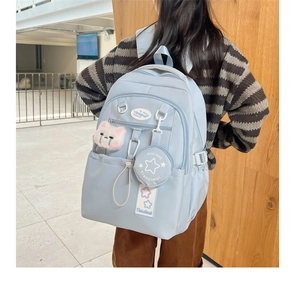 Light blue waterproof backpack with cute plush cat charm and star coin purse detail