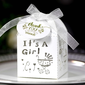 White laser-cut baby shower gift box with It's A Girl text and silver ribbon bow