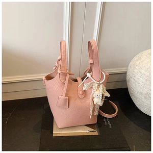 Pink lychee grain leather bucket bag with cute cartoon pearl charm and lace ribbon detail