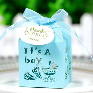 Detail of light blue baby stroller candy box with hollow design and thank you tag