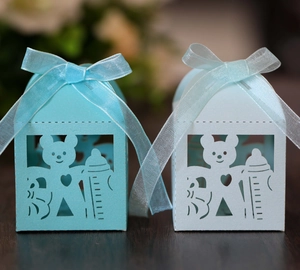 Detailed view of hollow teddy bear candy boxes with ribbons for baby showers