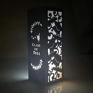Macro shot of Class of 2024 laser cut hollow paper lamp with LED light and star patterns