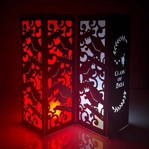 Detailed laser-cut paper lantern with Class of 2024 text and mortarboard icons