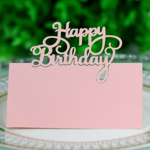 Pink glitter Happy Birthday place card on white porcelain plate with hollow lettering