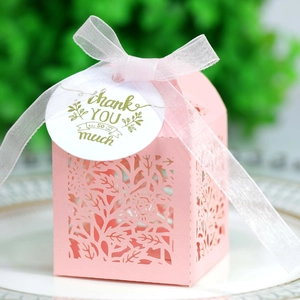 Pink hollow-out rose gift box with white ribbon and thank you tag for weddings