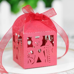 Detail of pink bear-shaped baby bottle gift box with laser-cut hollow baby letters