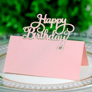 Detail of pink glitter Happy Birthday place card with laser-cut design for party table