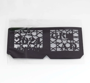 Detail view of Class of 2024 laser-cut black paper lantern decoration in clear packaging
