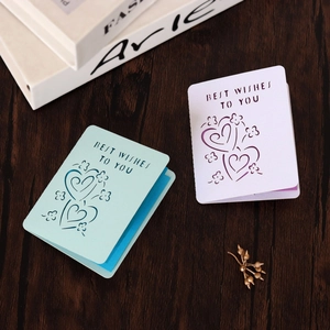 Detail of laser-cut heart and floral patterns on European style blessing cards
